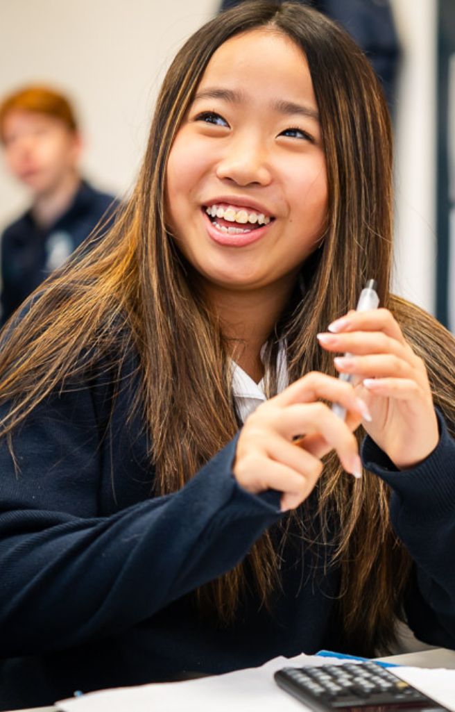 King's Ely student laughing in classroom