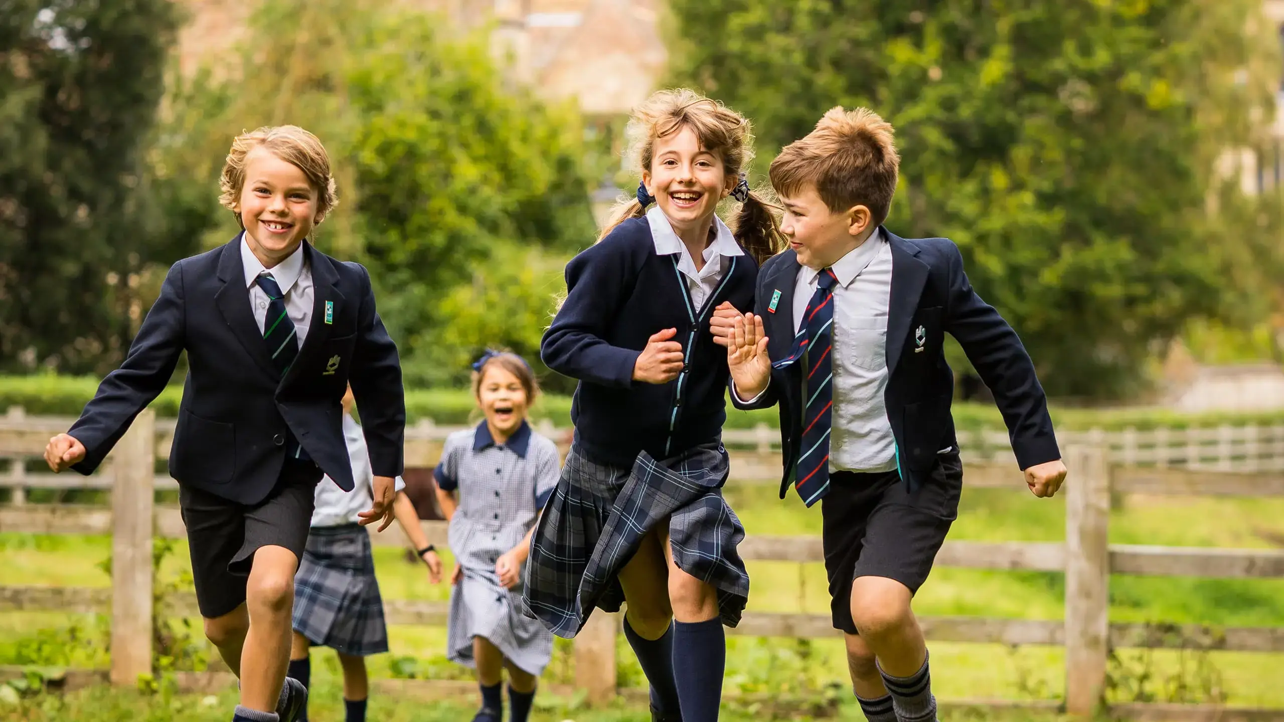 King’s Ely Prep children running outside with Ely Cathedral in the background