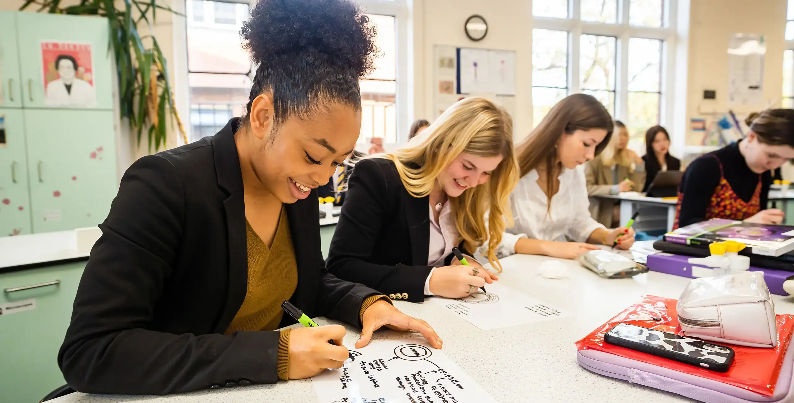 King’s Ely Sixth Form students working in classroom.